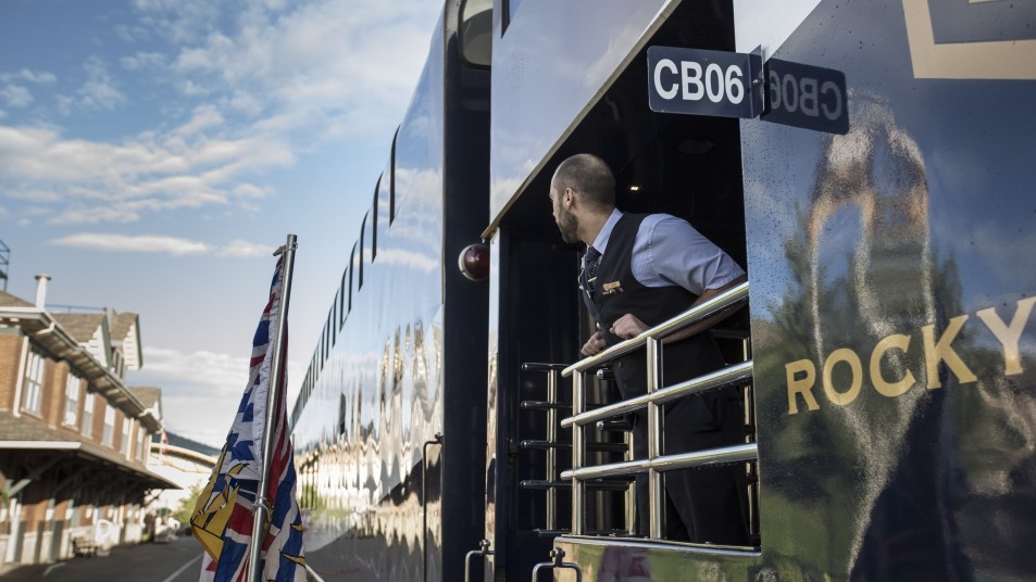 Host on Rocky Mountaineer train at Banff Station