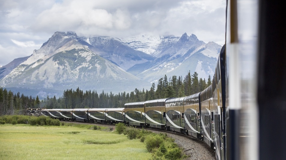 Rocky Mountaineer train with mountain in the background