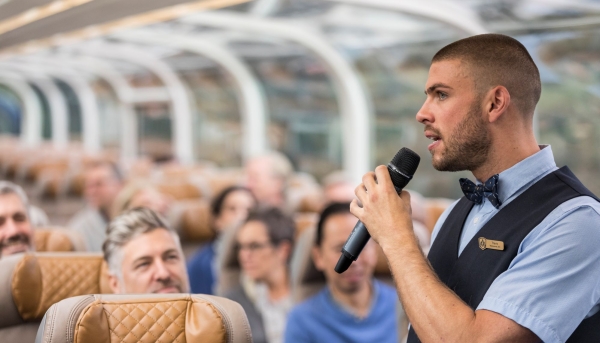 A Host in GoldLeaf Service providing commentary to guests.