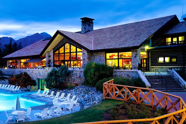 fairmont jasper park lodge pool at desk, mountains in the background