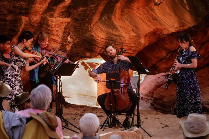 Musicians performing in canyon