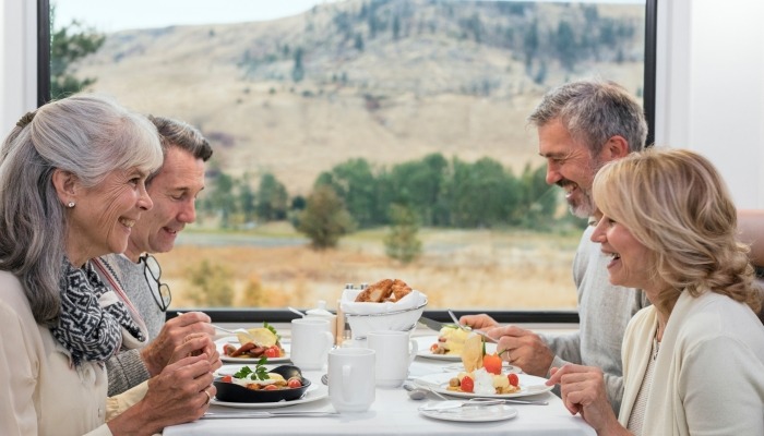 Guests eating breakfast in GoldLeaf dining coach