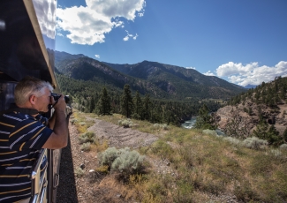 Guest taking a photo from the GoldLeaf outdoor viewing platform