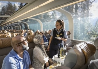 Host interacting with guests in a GoldLeaf car