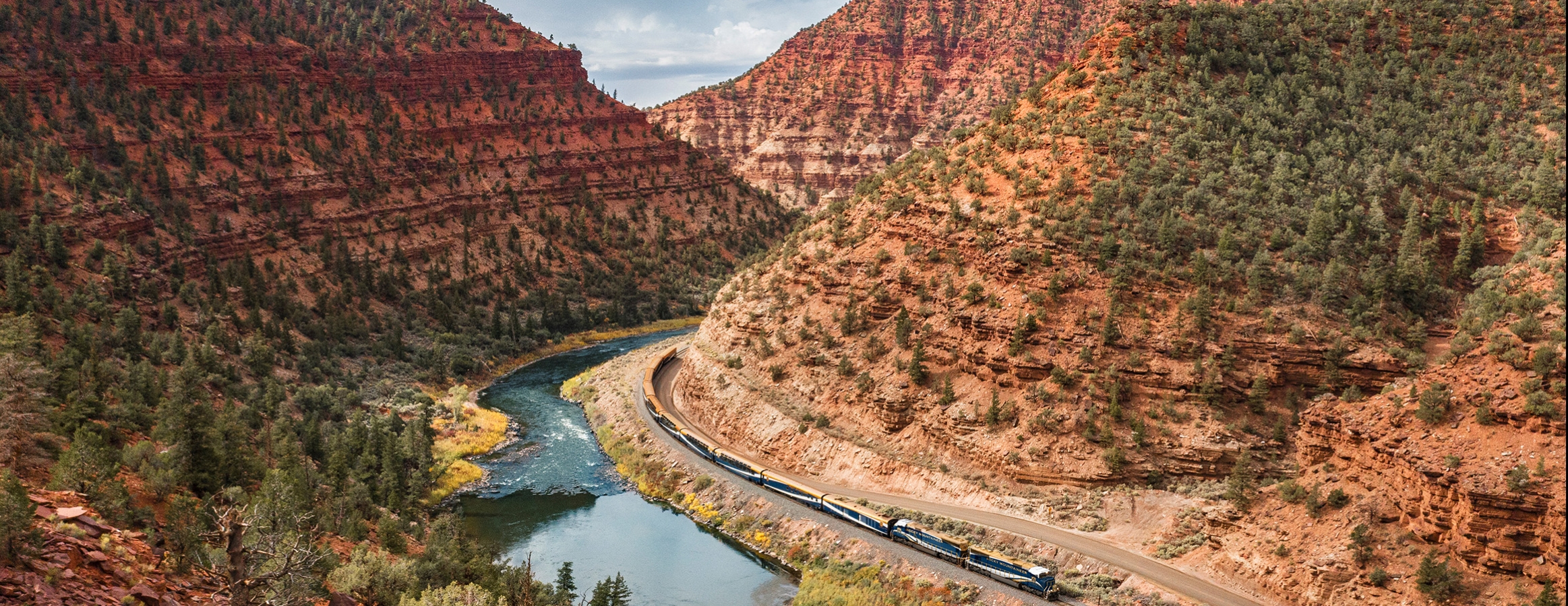 Rocky Mountaineer train travelling through Red Canyon, Utah