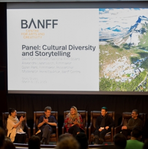 Arluk moderates a panel discussing cultural diversity and storytelling.
