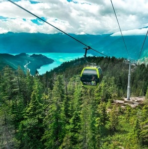 Sea to Sky gondola against cliffs and forest