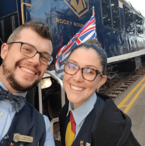Two hosts outside the train