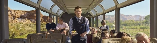 Onboard Host delivers dessert to guests onboard Rockies to the Red Rocks