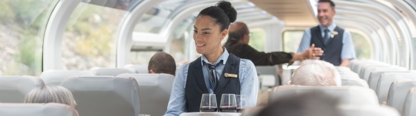 Host serving guests at their seats in GoldLeaf