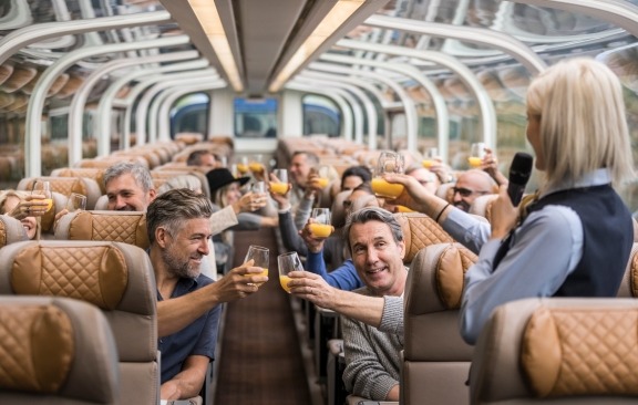 Guests raising a toast in Goldleaf service.
