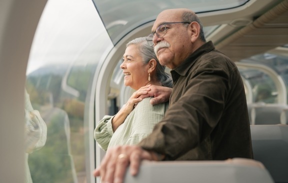 Couple on train in Goldleaf service.