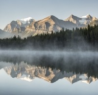 Mirrored mountains in lake in Jasper