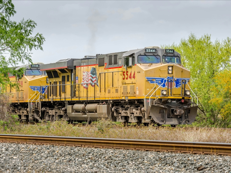 Yellow Union Pacific freight train traveling in Texas