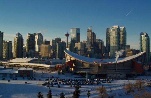 A view of the the downtown Calgary including notable buildings such as the Saddledome and Calgary Tower.