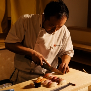 Chef Masayoshi Baba preparing sushi at Masayoshi. 